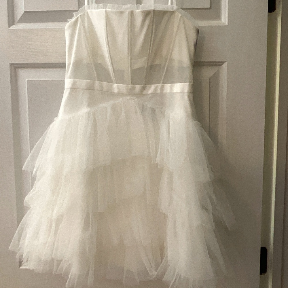 Fun medium-length white ruffle dress